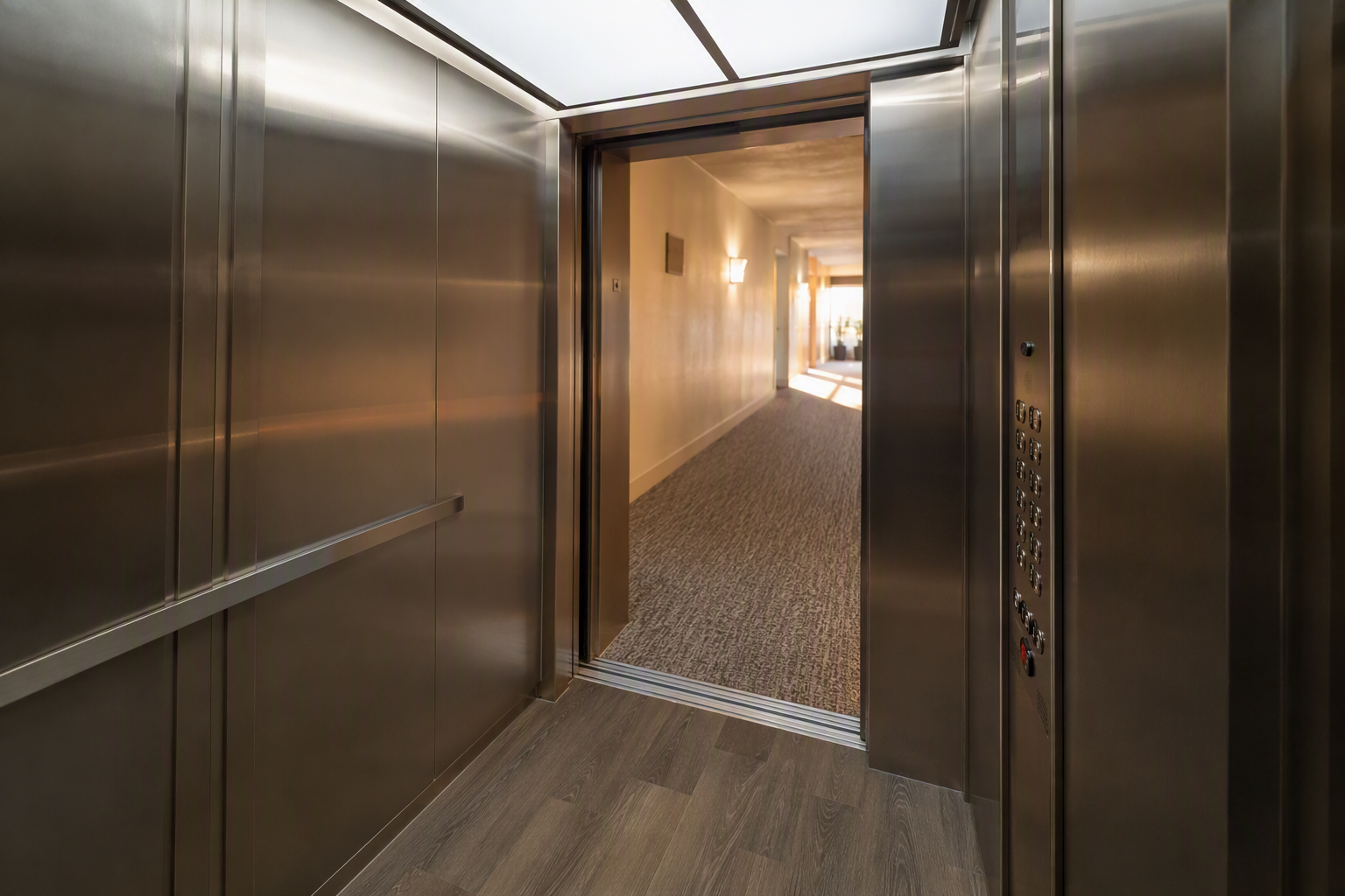 Newly modernized elevator cab interior with ADA-compliant fixtures and updated finishes in a Southern California residential building, showing 2027 modernization results.