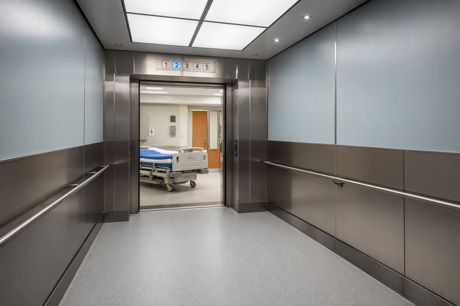 Spacious ADA-compliant hospital elevator cab interior in Southern California with handrails, non-slip flooring, and wide door opening sized for gurney transport per healthcare elevator code.
