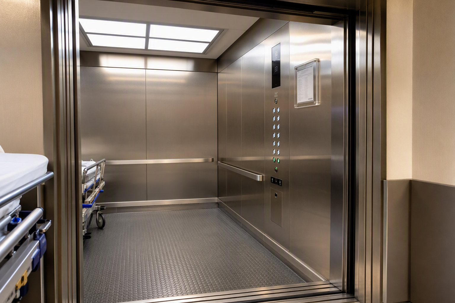 ADA-compliant hospital elevator cab interior with posted California Certificate of Inspection on the wall, showing Braille button panel and non-slip flooring in a Southern California medical facility