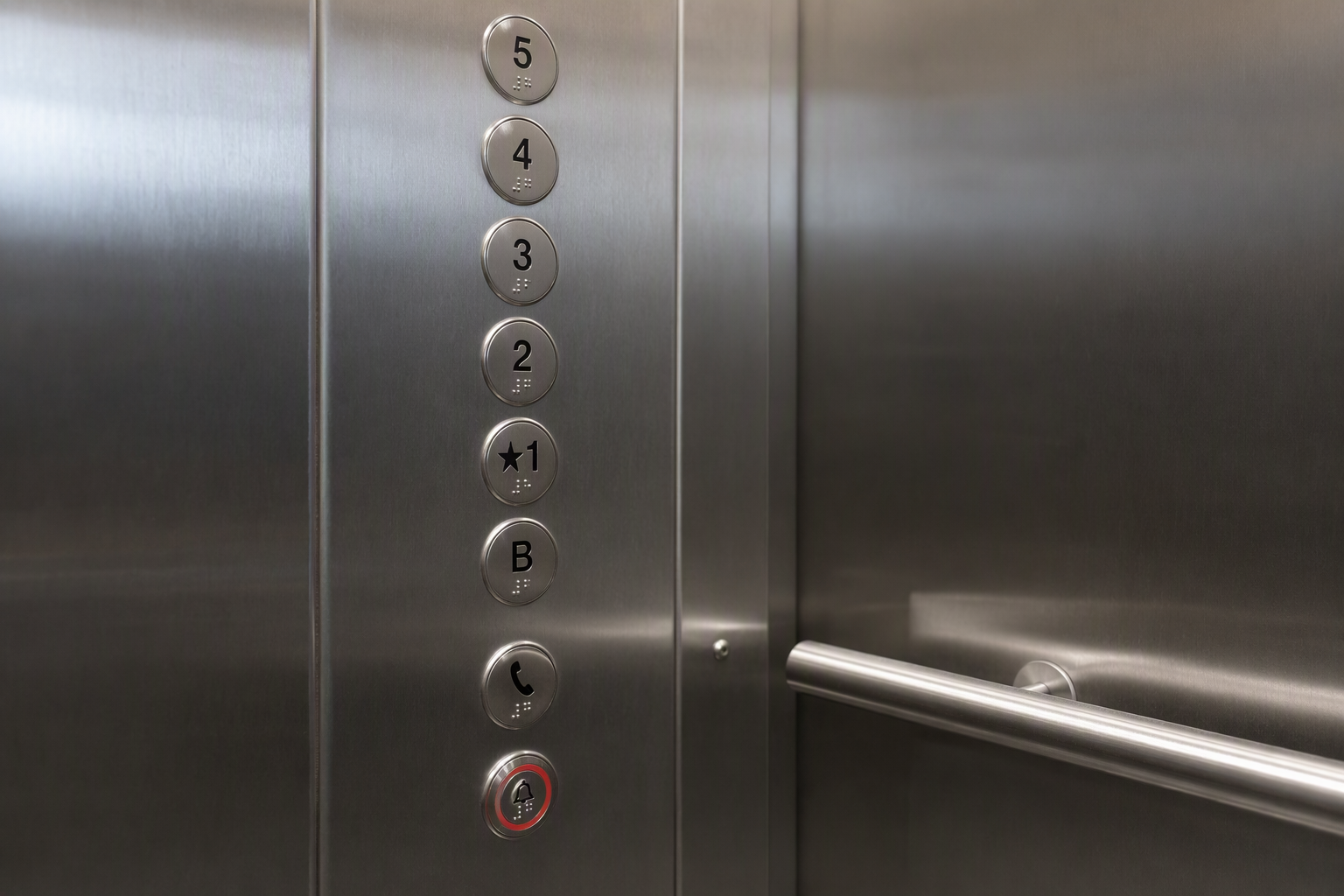 ADA-compliant elevator control panel with Braille labels and low-mounted buttons inside a California hospital elevator, supporting accessible elevator maintenance California standards.